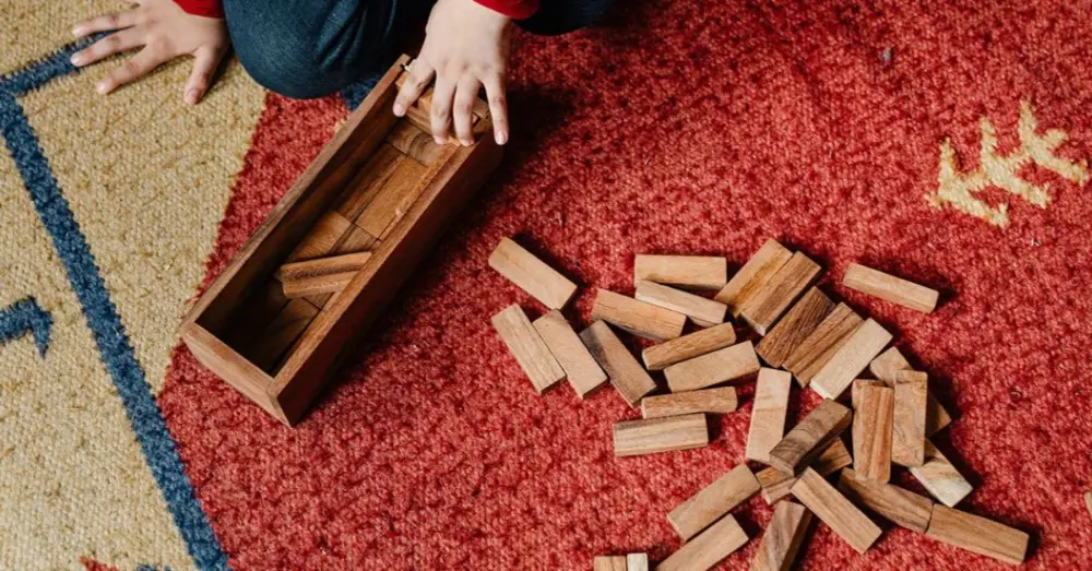 Child playing with wooden blocks