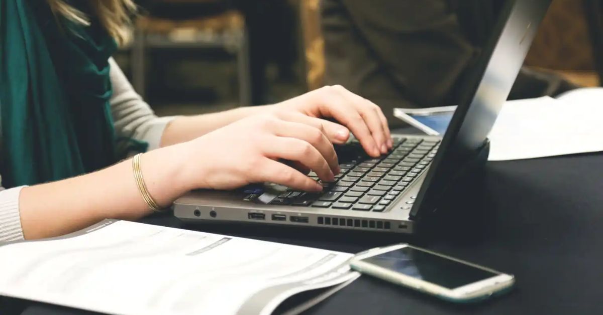 Person typing on a laptop